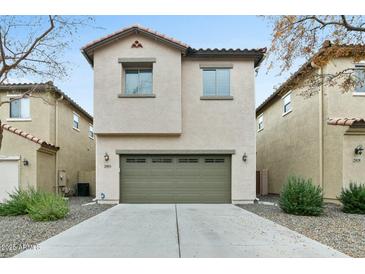 Tan two-story home with a two-car garage and desert landscaping at 25824 N 54Th Ave, Phoenix, AZ 85083