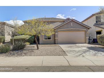 Charming single-Gathering home with a well-maintained front yard and a two-car garage at 42209 N 46Th Ln, Phoenix, AZ 85086