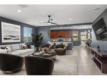 Beautiful living room with plush seating, modern decor, and an open concept design at 16430 W Alameda Rd, Surprise, AZ 85387