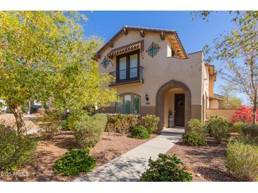 Charming two-story home with a well-manicured front yard and inviting arched entryway at 20539 W Terrace Ln, Buckeye, AZ 85396