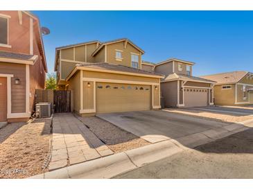 Charming two-story home featuring a spacious two-car garage with attractive architectural details and a well-maintained driveway at 4354 E Rosemonte Dr, Phoenix, AZ 85050