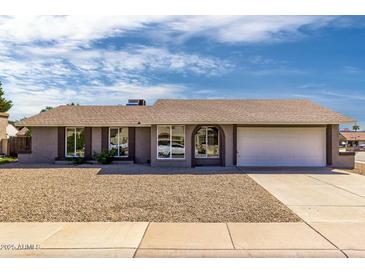 Charming single-story home featuring a well-maintained landscape and attached two car garage at 8837 W Coolidge St, Phoenix, AZ 85037