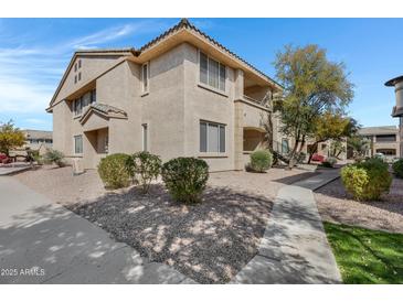 Charming condo featuring well-maintained landscaping and a neutral color scheme at 16013 S Desert Foothills Pkwy # 1133, Phoenix, AZ 85048