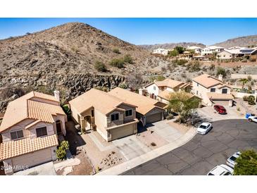 Residential neighborhood featuring houses with tile roofs, mountain views, and convenient street parking at 16834 S 20Th Pl, Phoenix, AZ 85048