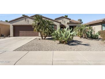 Charming single-story home featuring desert landscaping and a two-car garage at 16913 W Cortaro Point Dr, Surprise, AZ 85387