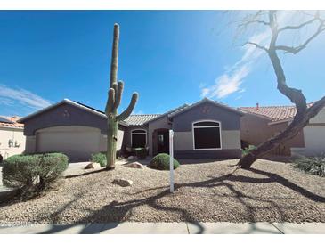Charming home featuring desert landscaping, a tile roof, and a well-maintained yard at 21901 N Sonora Ln, Sun City West, AZ 85375