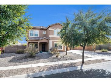 Charming two-story home with stucco exterior, tile roof, and well-maintained landscaping at 2987 E Powell Way, Gilbert, AZ 85298