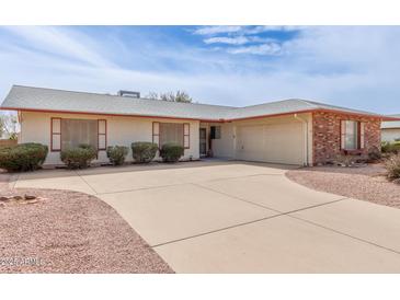 Charming single-story home featuring a two-car garage and well-maintained landscaping at 4701 E Walatowa St, Phoenix, AZ 85044