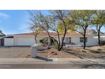 Charming single-story home showcasing a well-maintained front yard and neutral-toned exterior at 6019 E Windsor Ave, Scottsdale, AZ 85257