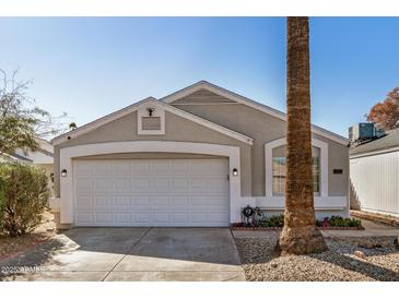 Charming single-story home with a two-car garage, desert landscaping and a new coat of exterior paint at 17406 N 28Th Dr, Phoenix, AZ 85053