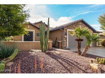 Charming single-story home with desert landscaping, stone accents, and a well-maintained front yard at 20515 N 271St Ave, Buckeye, AZ 85396