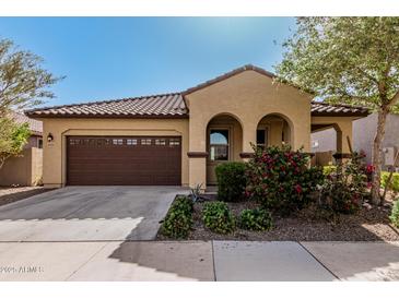Charming single-story home with desert landscaping and a two-car garage at 4695 N 204Th Ave, Buckeye, AZ 85396