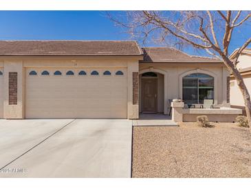 Charming single-story home featuring a two-car garage, covered entry and inviting front porch at 10960 E Monte Ave # 131, Mesa, AZ 85209