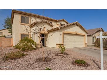 Inviting two-story home featuring a two-car garage and desert landscaping at 22644 W Mohave St, Buckeye, AZ 85326