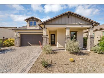 Charming single-story home with desert landscaping, brick accents, and a spacious two-car garage at 8140 E June St, Mesa, AZ 85207