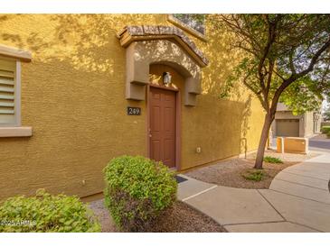 Charming townhome entrance featuring a covered porch and well-maintained landscaping at 17150 N 23Rd St # 249, Phoenix, AZ 85022
