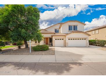 Charming two-story home with a three car garage, desert landscaping, and a mature shade tree in the front yard at 2551 E Buena Vista Pl, Chandler, AZ 85249