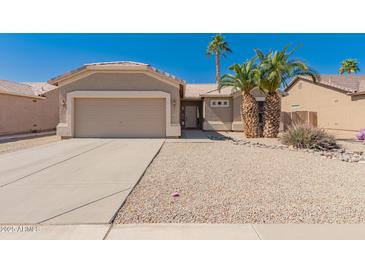 Charming single-story home featuring desert landscaping, a two-car garage, and a welcoming entrance at 6460 S Springs Pl, Chandler, AZ 85249