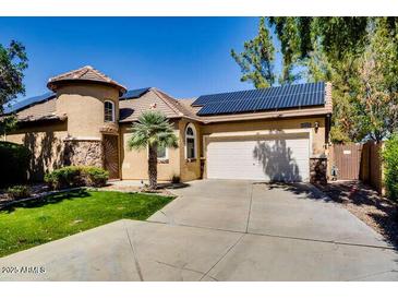 Inviting single-story home with desert landscaping, a two car garage, and a tile roof at 16026 N 171St Ln, Surprise, AZ 85388