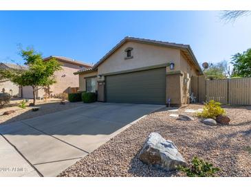 Charming single-story home with a two-car garage and low-maintenance desert landscaping at 40915 N Columbia Trl, Anthem, AZ 85086