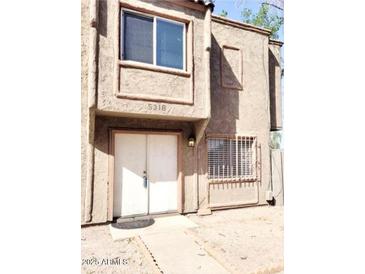 Inviting two-story home features a charming front entrance and classic architectural details at 5316 W Lynwood St, Phoenix, AZ 85043