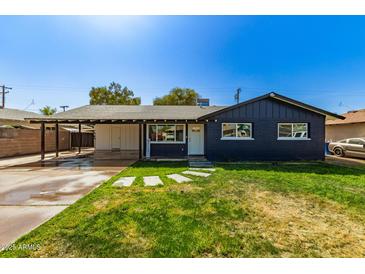 Charming single-story home with well-maintained lawn and inviting front entrance at 1827 E Jarvis Ave, Mesa, AZ 85204