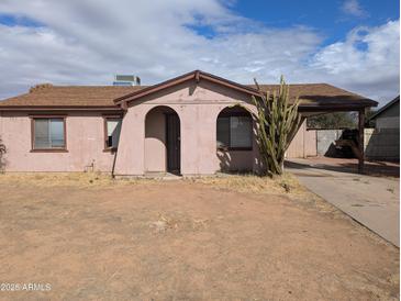 Exterior of a cozy single-story home with a desert landscape and arched entryway at 3452 E Evans Dr, Phoenix, AZ 85032