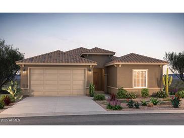 Charming single-story home featuring a tile roof, desert landscaping, and a spacious two-car garage at 17860 W Getty Dr, Goodyear, AZ 85338