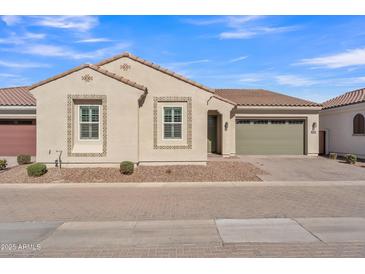 Charming single-story home with a neutral color palette, two-car garage, and tile accents at 2458 E Lark St, Gilbert, AZ 85297