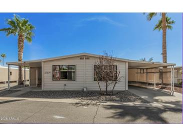 Charming single-story home with covered parking, desert landscaping and inviting curb appeal at 3104 E Broadway Rd # 276, Mesa, AZ 85204