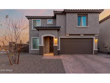 Charming two-story home with a two-car garage and covered entryway at 19703 W Badgett Ln, Litchfield Park, AZ 85340