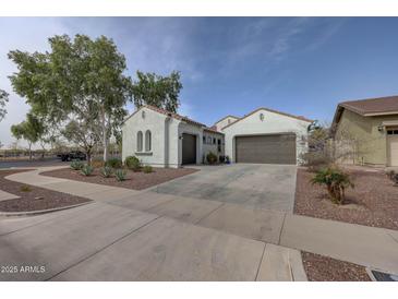 Charming single-Gathering home featuring a two-car garage and beautifully landscaped front yard at 20766 W White Rock Rd, Buckeye, AZ 85396