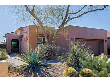 Charming home featuring desert landscaping, native plants, and a private two-car garage at 32960 N 70Th St, Scottsdale, AZ 85266