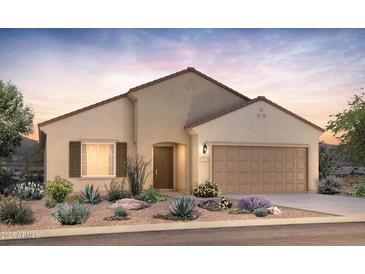 Charming single-story home featuring a two-car garage and a well-maintained desert landscaped front yard at 2649 N Riverside Dr, Florence, AZ 85132