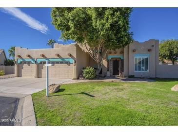 Charming single-story home with a well-manicured lawn and eye-catching architectural details at 5345 E Mclellan Rd # 83, Mesa, AZ 85205