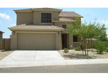 Charming two-story home featuring a two-car garage and drought-tolerant landscaping at 9413 W Pioneer St, Tolleson, AZ 85353