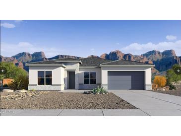 Charming single-story home with desert landscaping and mountain views at 15474 W Cottontail Ln, Surprise, AZ 85387