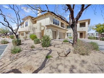 Beautiful condo featuring a private two-car garage and charming desert landscaping at 16800 E El Lago Blvd # 2072, Fountain Hills, AZ 85268