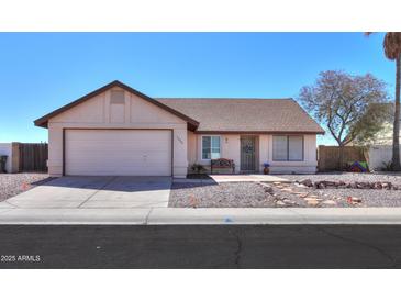 Charming single-story home with a well-manicured desert landscape and attached two-car garage at 1753 E Shasta St, Casa Grande, AZ 85122