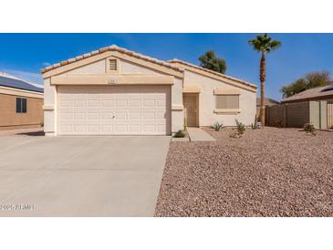 Charming single-story home showcasing a well-maintained yard and inviting facade at 2177 S Weaver Dr, Apache Junction, AZ 85120