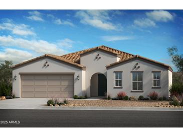 Beautiful single-story home with a neutral color palette, arched entry and a two-car garage at 2434 W Hidalgo Ave, Phoenix, AZ 85041