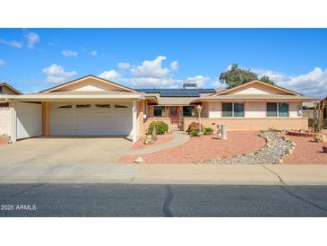 Charming single-story home with attached garage and low maintenance desert landscaping at 10228 W Andover Ave, Sun City, AZ 85351