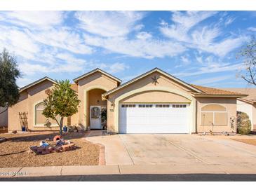 Charming single-story home with a two-car garage and well-maintained front yard landscape at 1538 E Peach Tree Dr, Chandler, AZ 85249