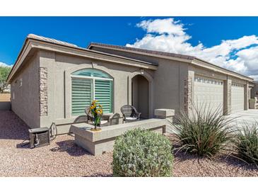 Charming single-story home with a neutral color scheme and a well-manicured front yard at 3117 S Signal Butte Rd # 501, Mesa, AZ 85212