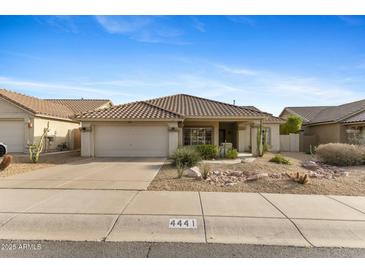 Charming single-story home with a desert landscaped front yard and a two car garage at 4441 E Via Dona Rd, Cave Creek, AZ 85331