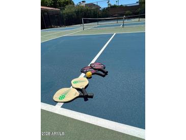 Community pickleball court complete with all necessary equipment for a fun-filled match at 3031 N Civic Center Plz # 306, Scottsdale, AZ 85251