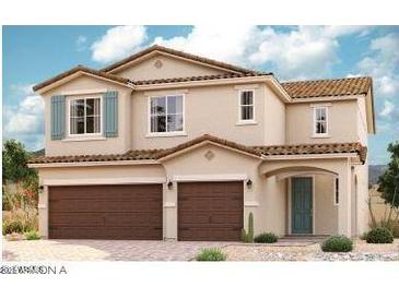 Charming two-story home featuring a two-car garage and desert landscaping at 40547 W Michaels Dr, Maricopa, AZ 85138