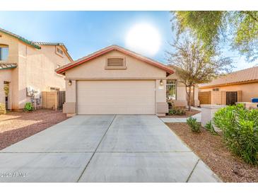 Charming single-Gathering home with a two-car garage and well-maintained front yard at 7336 S 253Rd Ave, Buckeye, AZ 85326