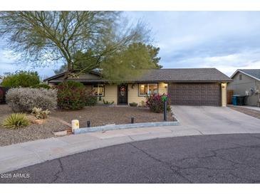 Charming single-story home with a well-maintained yard and a two-car garage at 14407 N 35Th Pl, Phoenix, AZ 85032