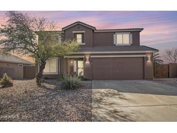 Inviting two-story home featuring a neutral color palette, well-maintained landscaping, and a spacious two-car garage at 1805 E Aloe Pl, Chandler, AZ 85286